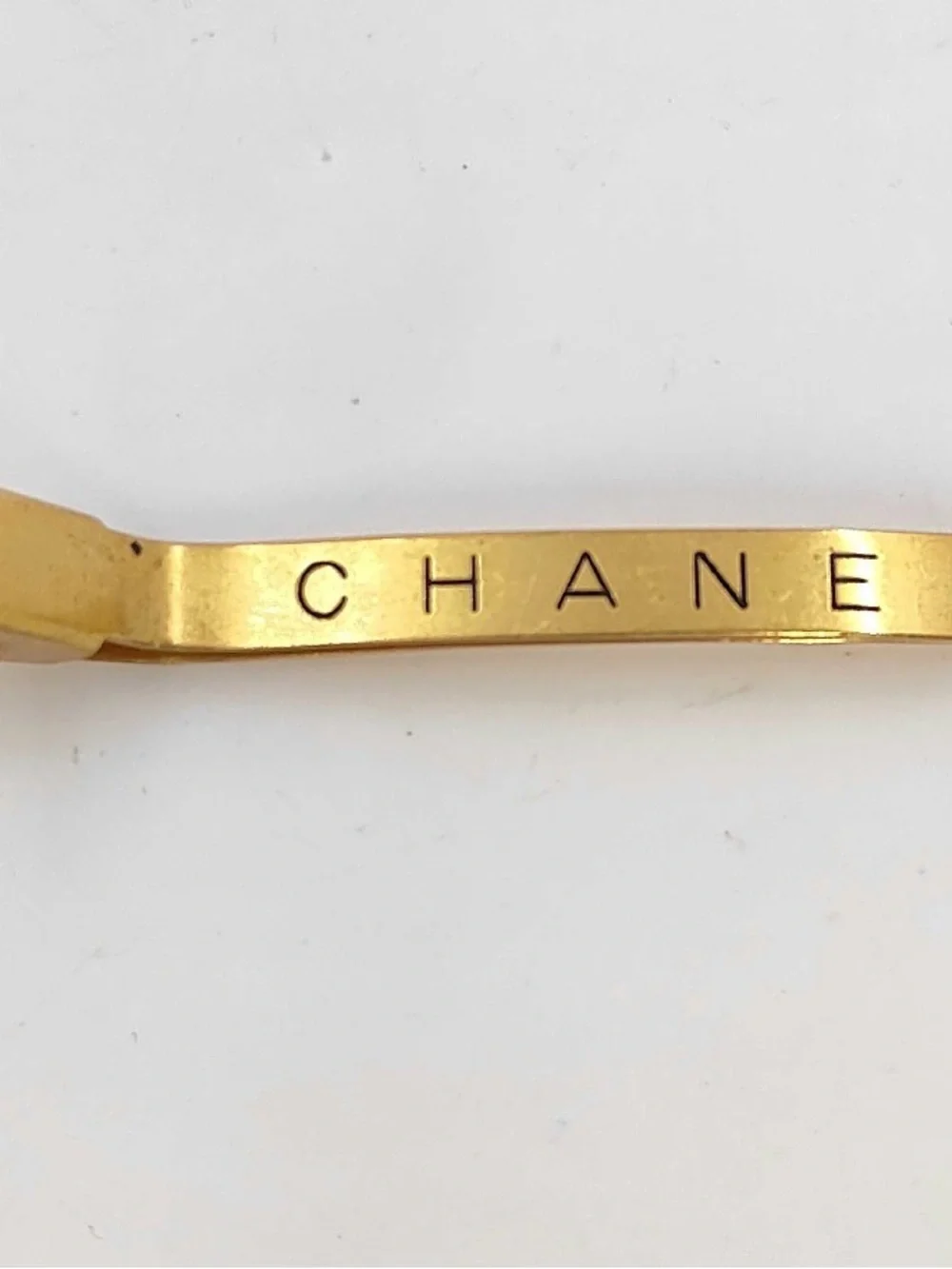 CHANEL Gold Tone Logo Hair Barrette